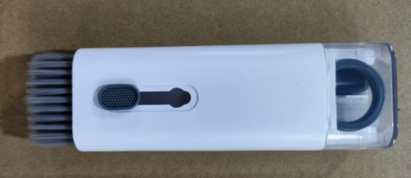 Multifunctional tech cleaning kit with white, pink, and blue tools for keyboards, smartphones, and cameras